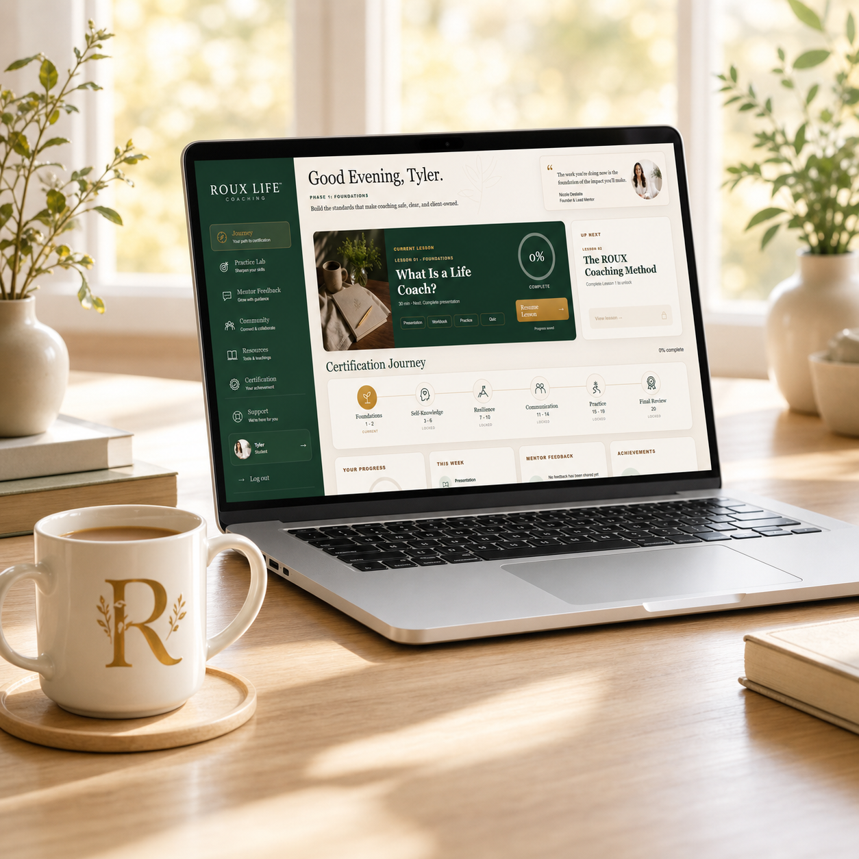Roux Life Academy dashboard on a laptop in a bright home office
